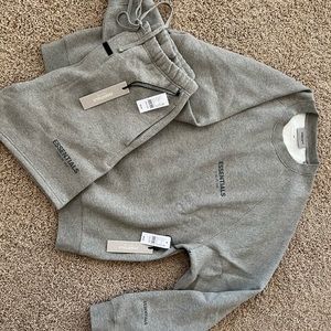 FEAR OF GOD ESSENTIALS. Large Crew Neck and Medium Shorts in color Heather Oat